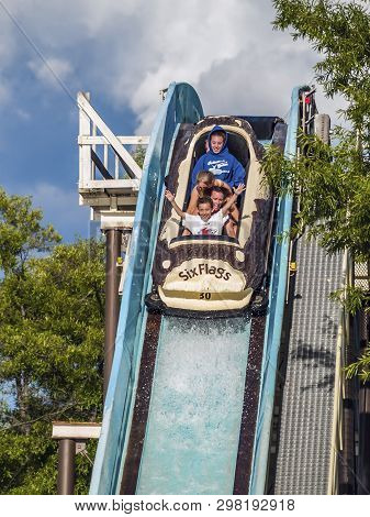 Jackson, New Jersey - June 30: A Family Enjoys A Log Flume Ride At Six Flags Great Adventure On June