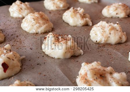Gougere French Pastries On A Dripping Pan Before Baking