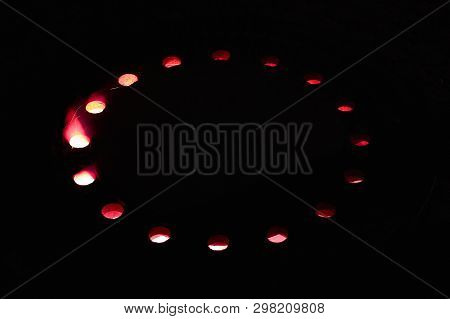 Red Fire Light Shines Through Holes, A Wonderful Texture Of Gobos Or Lightrays