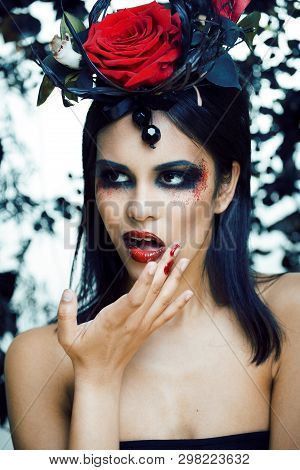 Pretty Brunette Woman With Rose Jewelry, Black And Red, Bright Make Up Kike A Vampire Closeup Red Li