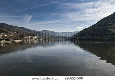 View Of The Pinhao Village With Terraced Vineyards And The Douro River, In Portugal; Concept For Tra