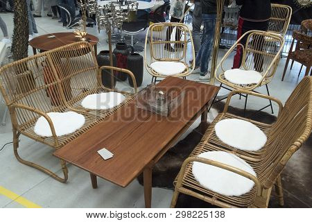 Old Furniture In A Living Room Arrangement With A Wooden Coffee Table In The Middle Surrounded By Wi