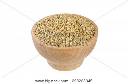 Raw Buckwheat In Wooden Bowl Isolated On White Background. Nutrition. Food Ingredient.
