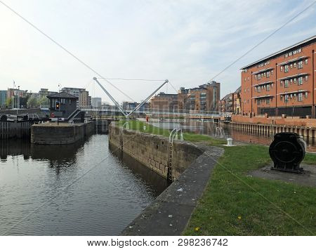 The Leeds Lock Entrance To Clarence Dock With Footbridge Over The River Aire And Historic Gates And 
