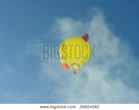 Hot Air Balloon flying through clouds