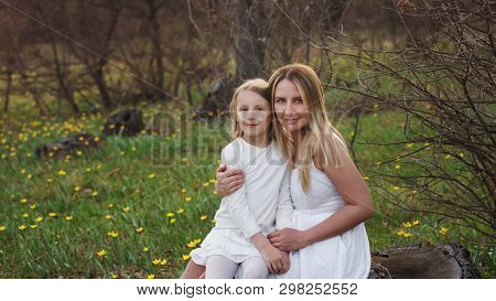 Happy Family Walks In The Spring Meadow