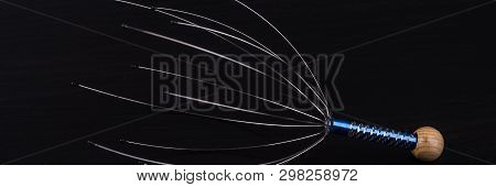 Device For Head Massage. Black Background. Orgasm. Relaxation.
