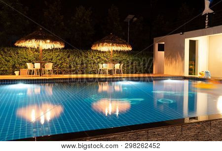 Beautiful Blue Water At Night ,swimming Pool For Background. 