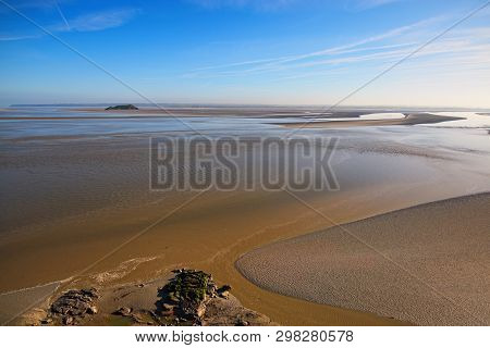 Low Tide In Front Of Mont Saint-michel Abbey. Amazing Landmark. Sunny Spring Morning View. Normandy,