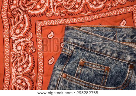 Classic Jeans With Five Pockets Close-up. Paisley Patterned Bandana, Classic Orange And White Necker