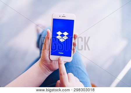 Chiang Mai, Thailand - Apr.08,2019: Woman Holding Apple Iphone 6s Rose Gold With Dropbox On Screen. 