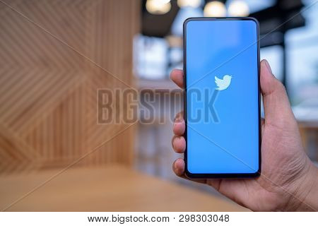 Chiang Mai, Thailand - Mar. 23,2019: Man Holding Xiaomi Mi Mix 3 With Twitter App On The Screen.twit