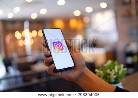 Chiang Mai, Thailand - Mar. 24,2019: Man Holding Xiaomi Mi Mix 3 With Instagram Application On The S