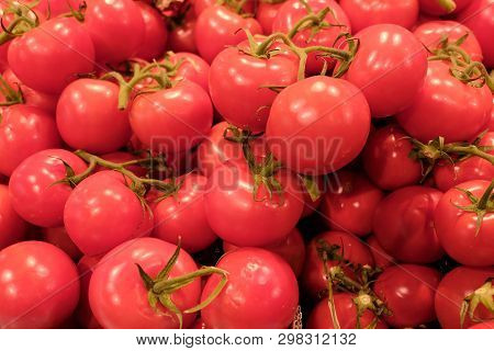 Red Tomatoes Background. Group Of Tomatoes On Counter At Stote