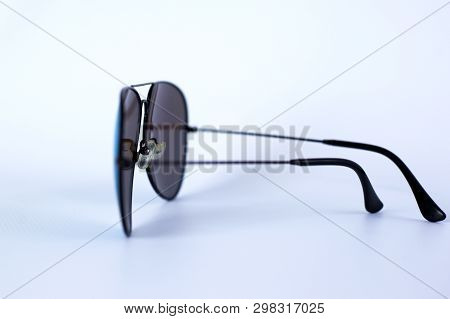 Blue Mirrored Sunglasses With Anti-reflective Coating And Uv Protection On A White Background. Close
