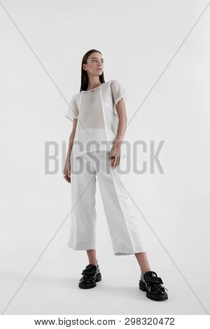 Confident Woman Wearing White Minimalist Gown