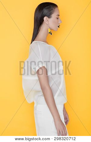 Unemotional Fashionable Model On Yellow