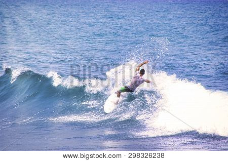 Hossegor, France - February Circa , 2019. An Unidentified Surfer Man Catching Riding On An Ocean Wav