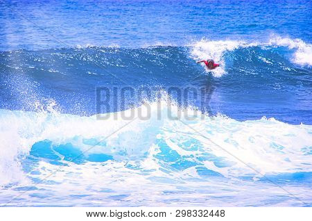 Hossegor, France - February Circa , 2019. An Unidentified Surfer Man Catching Riding On An Ocean Wav