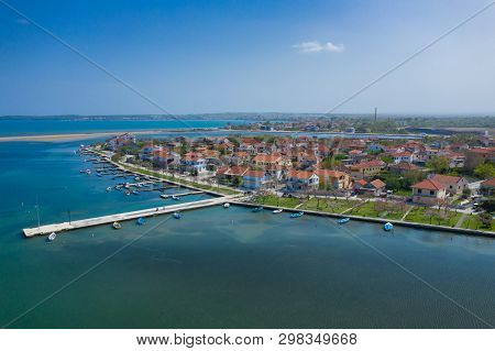 Aerial View Of City Of Nin. Summer Time In Dalmatia Region Of Croatia. Coastline And Turquoise Water
