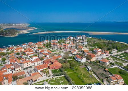Aerial View Of City Of Nin. Summer Time In Dalmatia Region Of Croatia. Coastline And Turquoise Water