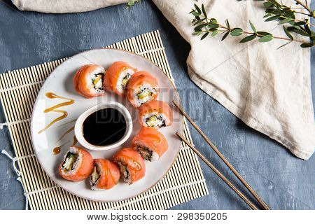 Salmon Sushi Set On The Plate With Soe Sauce. Top View, Copy Space For Text