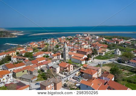 Aerial View Of City Of Nin. Summer Time In Dalmatia Region Of Croatia. Coastline And Turquoise Water