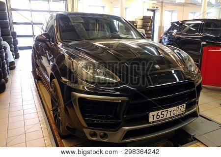 Moscow, Russia - April 29, 2019: Exclusive Black Porsche Cayenne On Suspension Check Stand In Servic