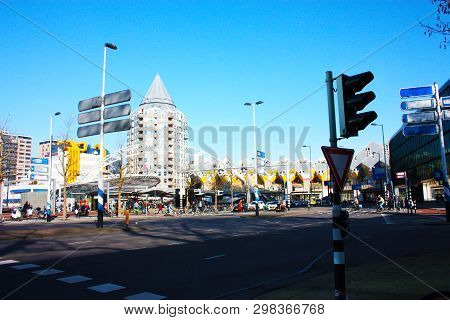 Daily City Chaos In The Hectic And Modern Station Of The Metropolis Of Rotterdam. Yellow Cubic House