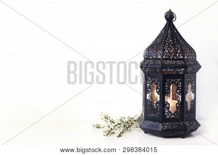 Ornamental Black Moroccan, Arabic Lantern With Blooming Prunus Tree Branches On White Table. Greetin