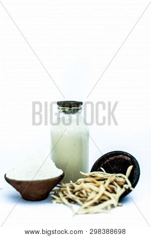 Popular Indian & Asian Ayurvedic Herb Isolated On White In A Clay Bowl I.e. Musli Or Safed Musli Or