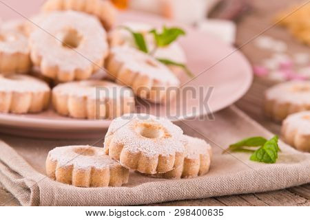 Canestrelli Biscuits With Mint On Wooden Table.