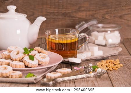 Canestrelli Biscuits With Mint On Wooden Table.