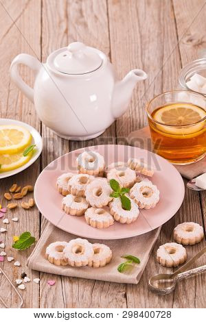 Canestrelli Biscuits With Mint On Wooden Table.