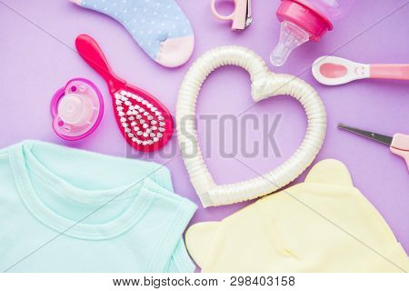 Newborn Baby Story. Strow Heart And Childrens Toys, Scissors, Baby Bottle, Nipple, Hairbrush On Viol