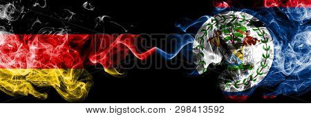 Germany Vs Belize, Belizean Smoky Mystic Flags Placed Side By Side. Thick Colored Silky Smoke Flags 