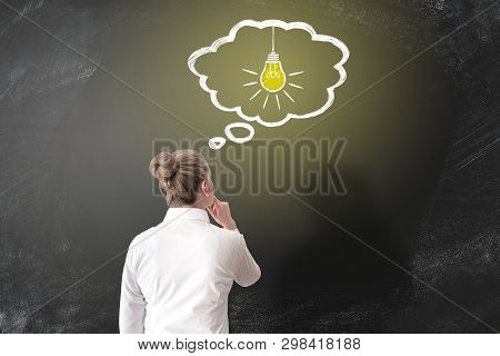Rear View Of Caucaian Woman Having An Idea