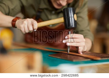 Close Up Of Woman Artisan Making Leather Belt In Leatherworking Shop , Copy Space