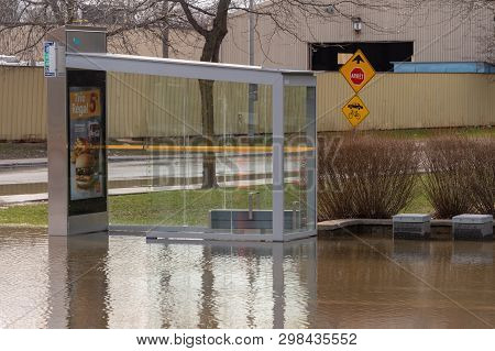 Pierrefonds-roxboro, Quebec, Canada - 29 April 2019: Submerged Bus Stop During Spring Floods