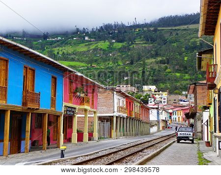 Alausi, Ecuador - February 18, 2015: Train Tracks Going Through The Town Along The Colorful Building