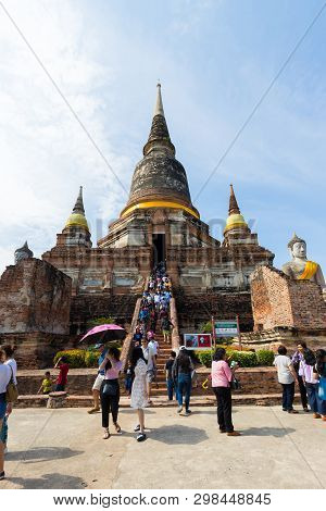 People Visiting The Temple Of Ayutthaya Historical Park On Thailand.