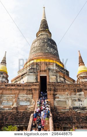 People Visiting The Temple Of Ayutthaya Historical Park On Thailand.