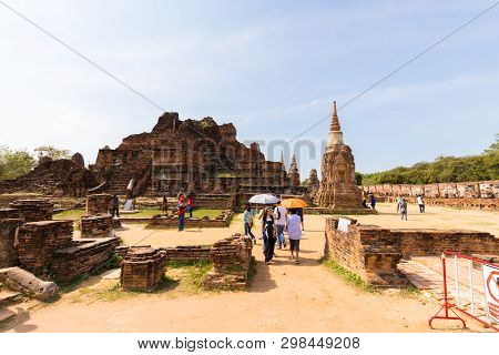 People Visiting The Temple Of Ayutthaya Historical Park On Thailand..