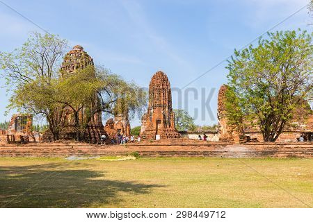 People Visiting The Temple Of Ayutthaya Historical Park On Thailand..