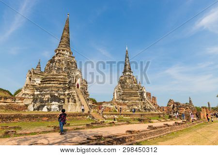 People Visiting The Temple Of Ayutthaya Historical Park On Thailand.