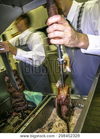 Sao Paulo, Sp, Brazil, Ocotober 07, 2003. Skewer With Meat Inside The Kitchen Of A Steakhouse Of Sao