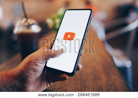 Chiang Mai, Thailand - Mar. 24,2019: Man Holding Xiaomi Mi Mix 3 With Youtube Apps On Screen. Youtub