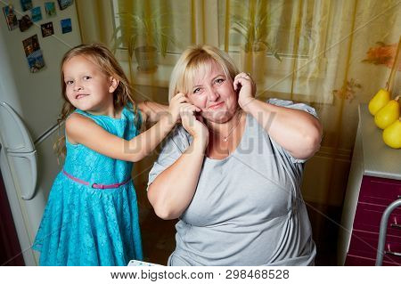Kirov, Russia - November 04, 2018: Adalt Mother And Her Young Daughter In A Kitchen
