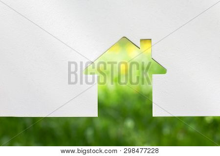 Abstract House On Green Grass. Eco House. Copy Space