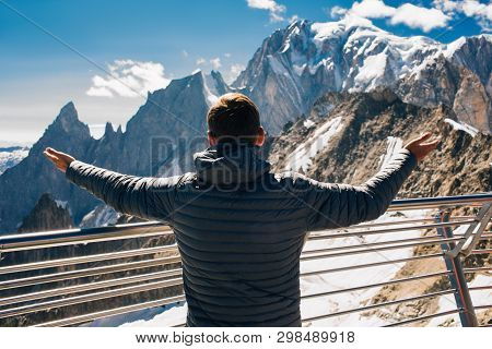 Tourist Looking At The Mountain Mont Blanc Standing On The Terrace Punta Helbronner, Courmayeur Ital